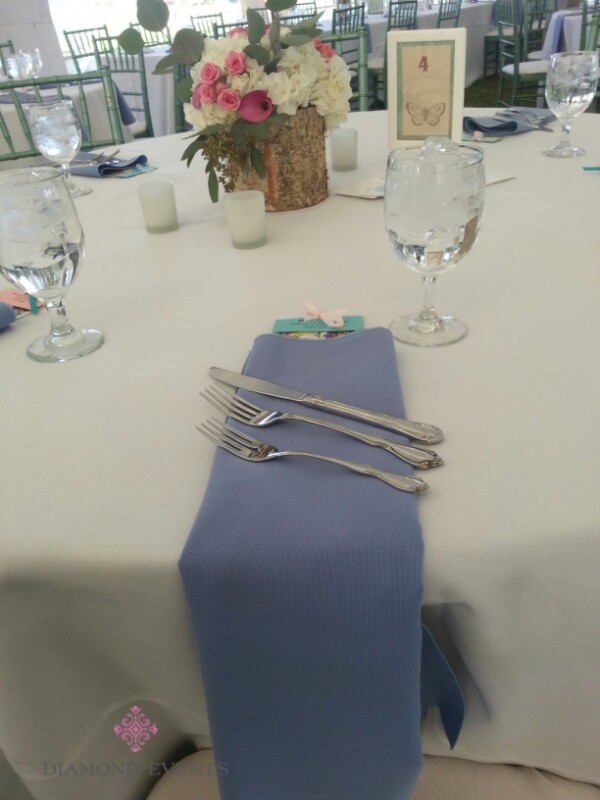 Blue napkin folded over the edge of the table